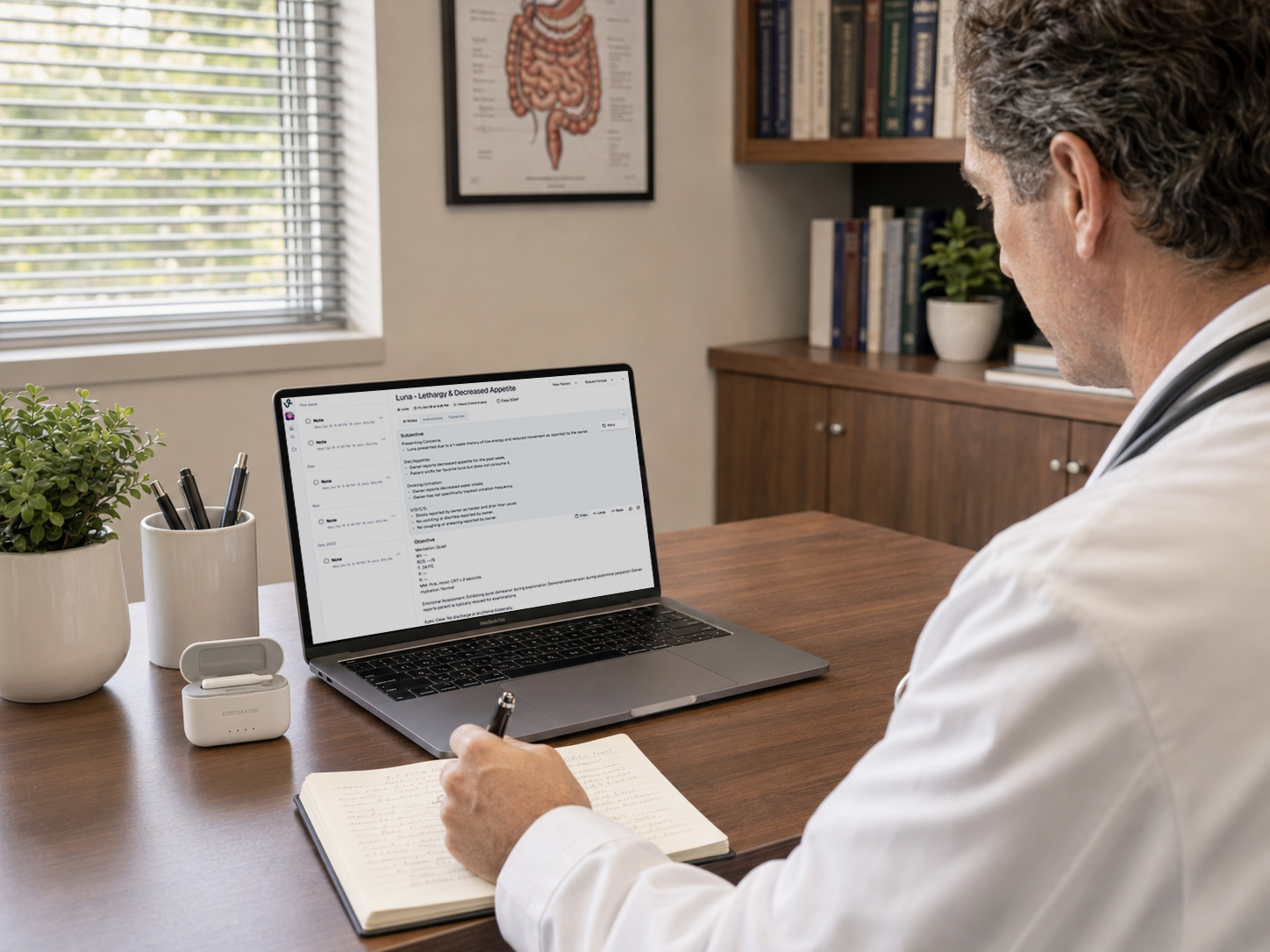 Clinician reviewing a CortexaNote note on a laptop with the recorder docked nearby